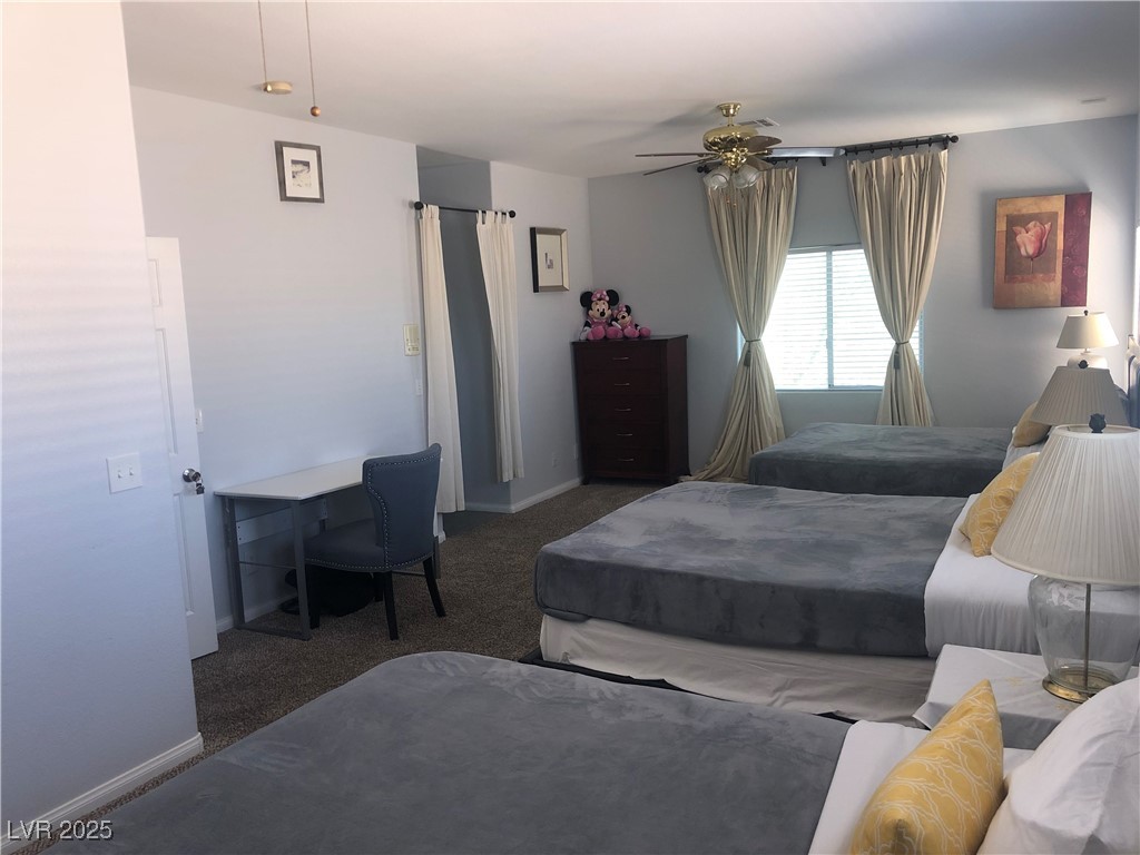5423 Dancing Bear Drive Las Vegas, NV 89113 - Photo 8 of 18 Bedroom featuring carpet and a ceiling fan