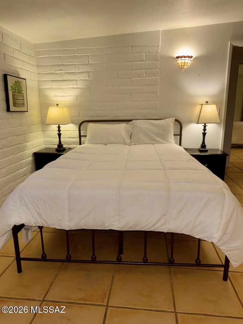 4415 North Swan Road Tucson, AZ 85718 - Photo 15 of 33 a bedroom with a bed and a night stand