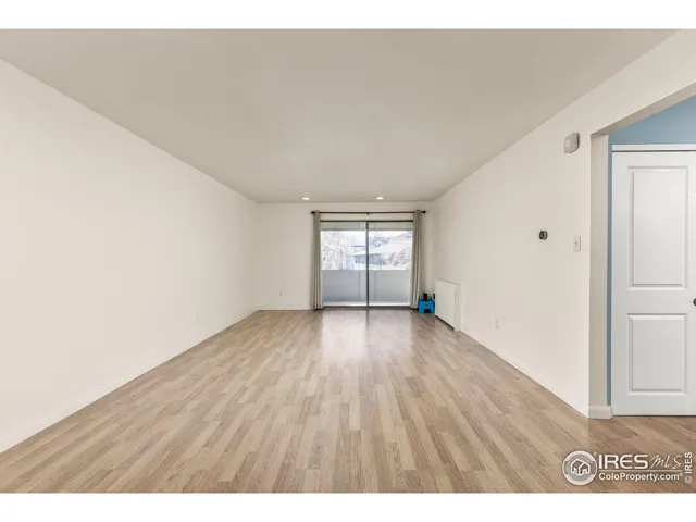 a bedroom with a bed and a night stand