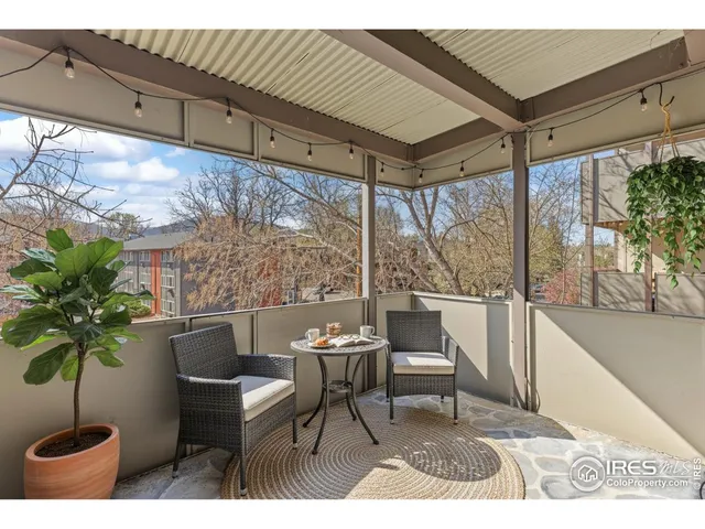 a outdoor living space with furniture and a potted plant