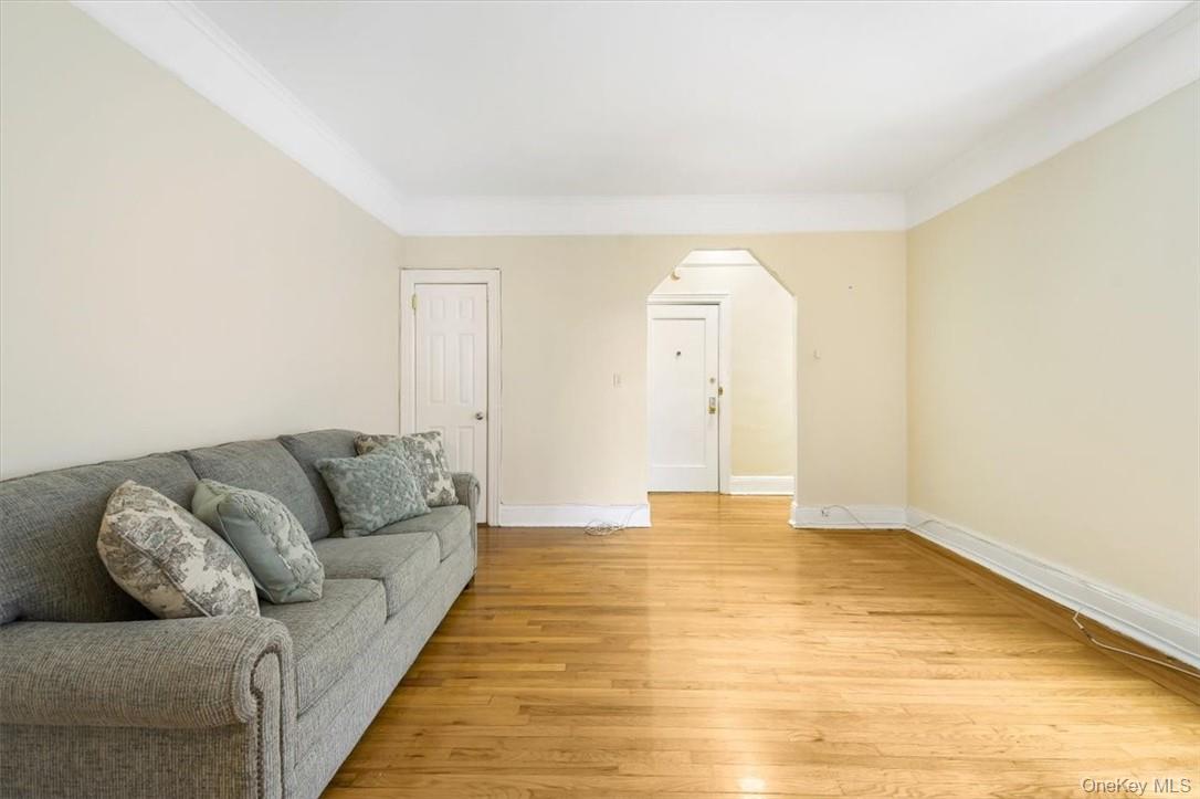 663 Locust Street, Unit 4A Mount Vernon, NY 10552 - Photo 8 of 31 a living room with furniture and a wooden floor