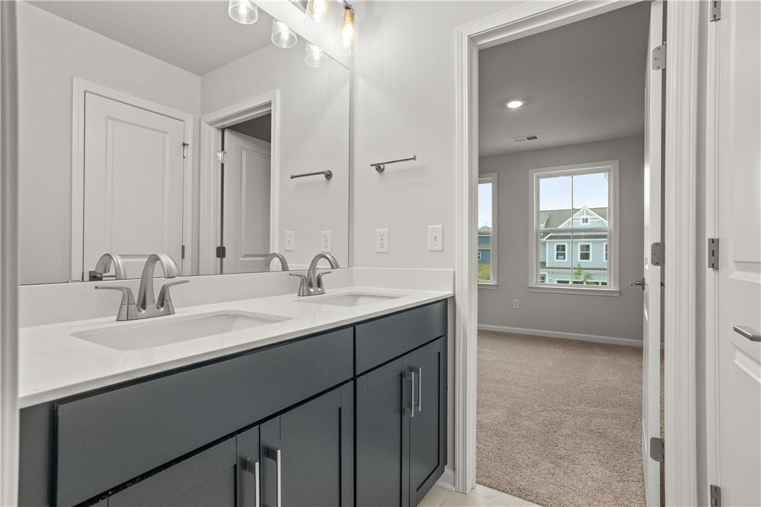 629 Sweetspire Trail, Unit 149 Seneca, SC 29678 - Photo 20 of 30 Double vanity with quartz countertops and sleek fixtures offers both style and function.