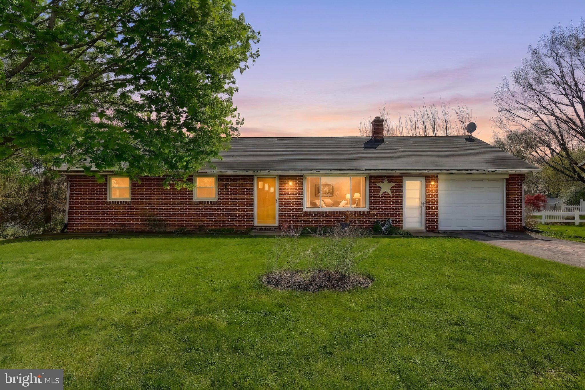 Charming brick home at twilight glow.