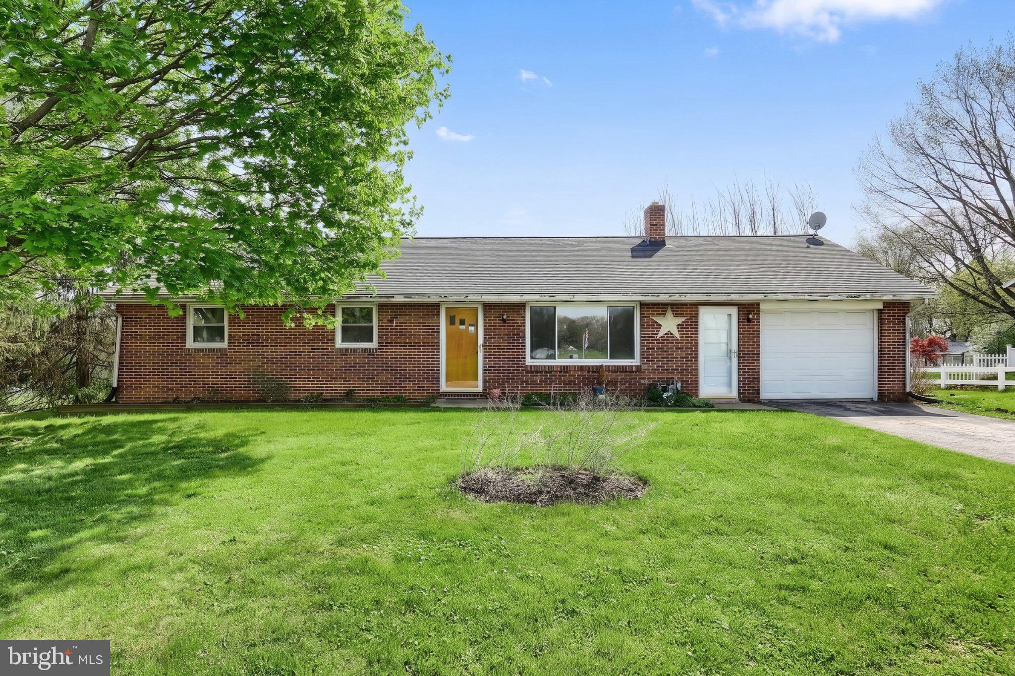 860 Witmer Road York, PA 17406 - Photo 5 of 40 Charming brick home with lush greenery.
