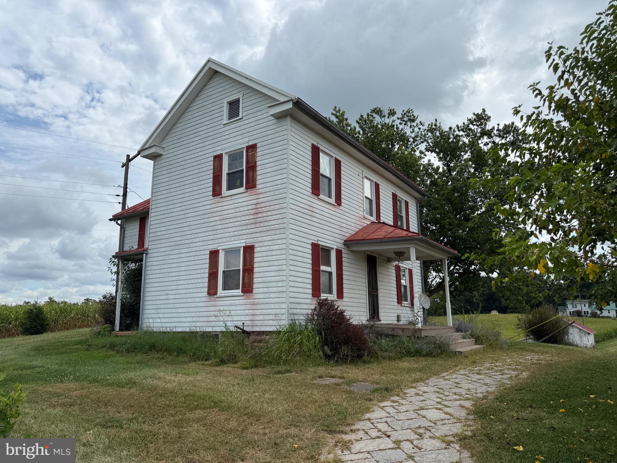 1309 Trevanion Road Union Bridge, MD 21791 - Photo 3 of 70 a front view of a house with a yard
