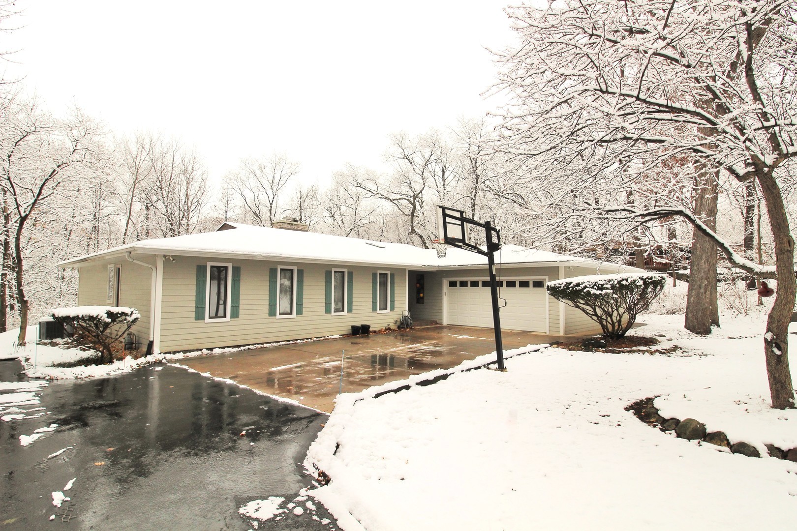 178 Stonegate Road Trout Valley, IL 60013 - Photo 1 of 24 a view of a house with snow on the background