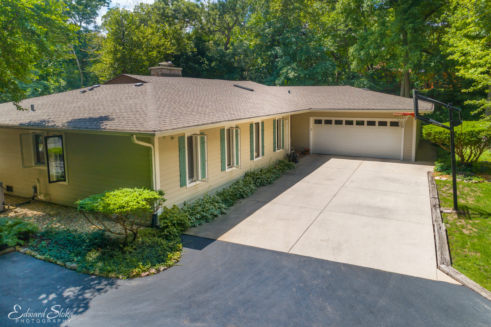 178 Stonegate Road Trout Valley, IL 60013 - Photo 2 of 24 a view of a house with a yard and potted plants