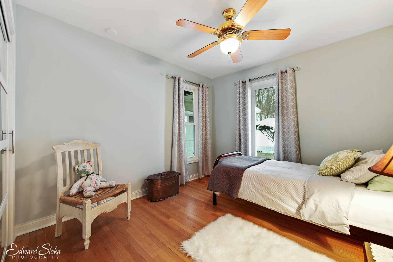 178 Stonegate Road Trout Valley, IL 60013 - Photo 19 of 24 a bedroom with a bed and a chandelier