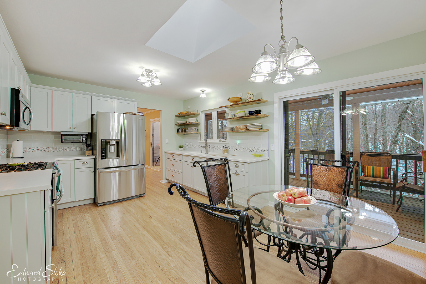 178 Stonegate Road Trout Valley, IL 60013 - Photo 8 of 24 a kitchen with stainless steel appliances granite countertop a refrigerator a stove top oven a dining table and chairs