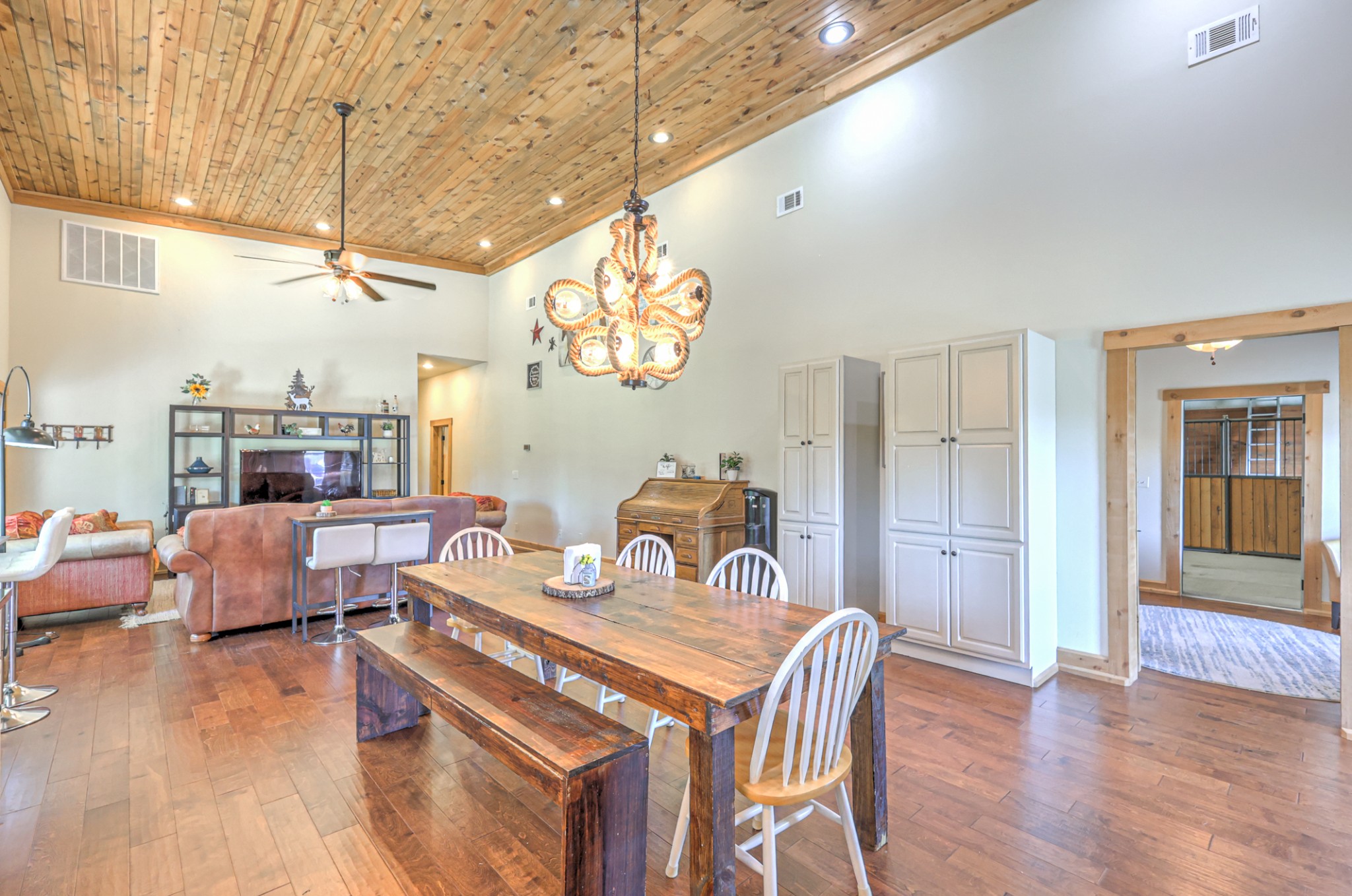 5542 Southeast Tater Peeler Road Lebanon, TN 37090 - Photo 13 of 61 a view of a dining room with furniture a chandelier and wooden floor