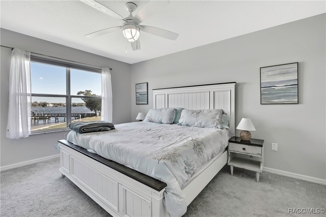 2855 North Rivers Edge Boulevard, Unit 213 Crystal River, FL 34429 - Photo 24 of 62 a bedroom with bed and window
