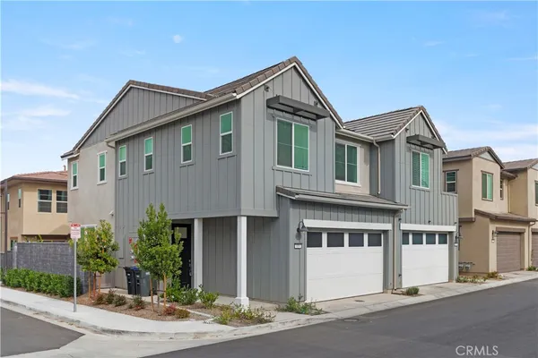 a front view of a house with yard