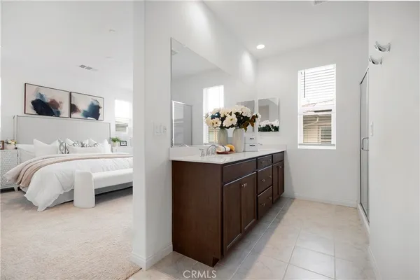 a bathroom with a sink vanity and mirror