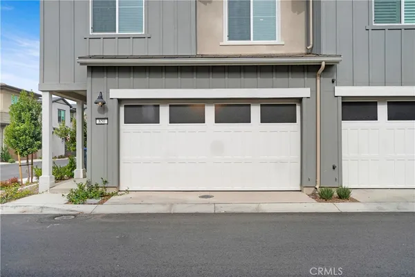 a front view of a house with a garage