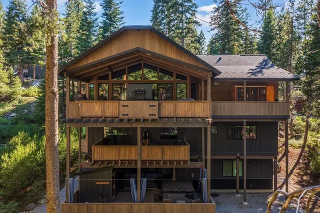 a large kitchen with a table and chairs