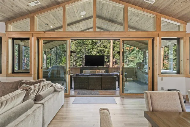 a kitchen with stainless steel appliances granite countertop a stove a sink and wooden cabinets