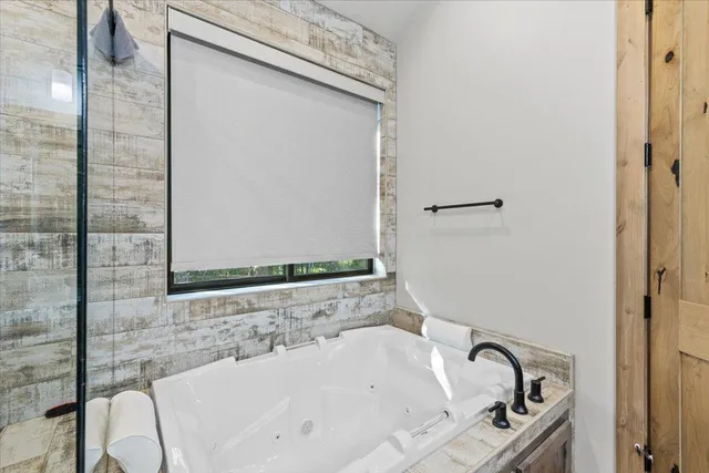 a view of a livingroom with furniture and a flat screen tv