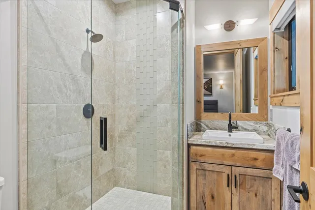 a bedroom with a bed and a television