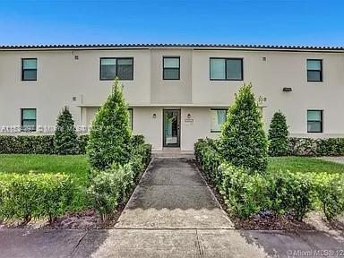 4203 Southwest 15th Street, Unit 2 Miami, FL 33145 - Photo 12 of 13 front view of house with a yard