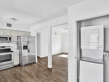 4203 Southwest 15th Street, Unit 2 Miami, FL 33145 - Photo 2 of 13 a view of a refrigerator in kitchen and wooden floor