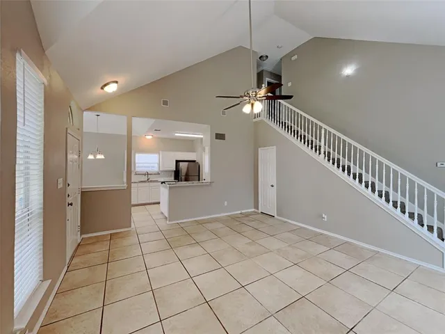 a view of an empty room with glass door