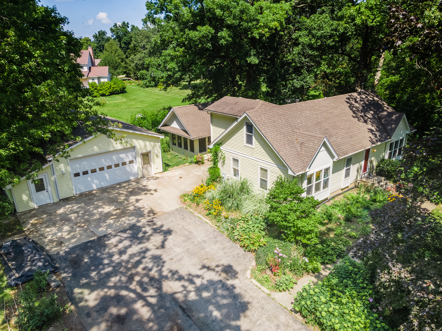 16463 Plank Road Sycamore, IL 60178 - Photo 1 of 36 an aerial view of a house with yard swimming pool and outdoor seating