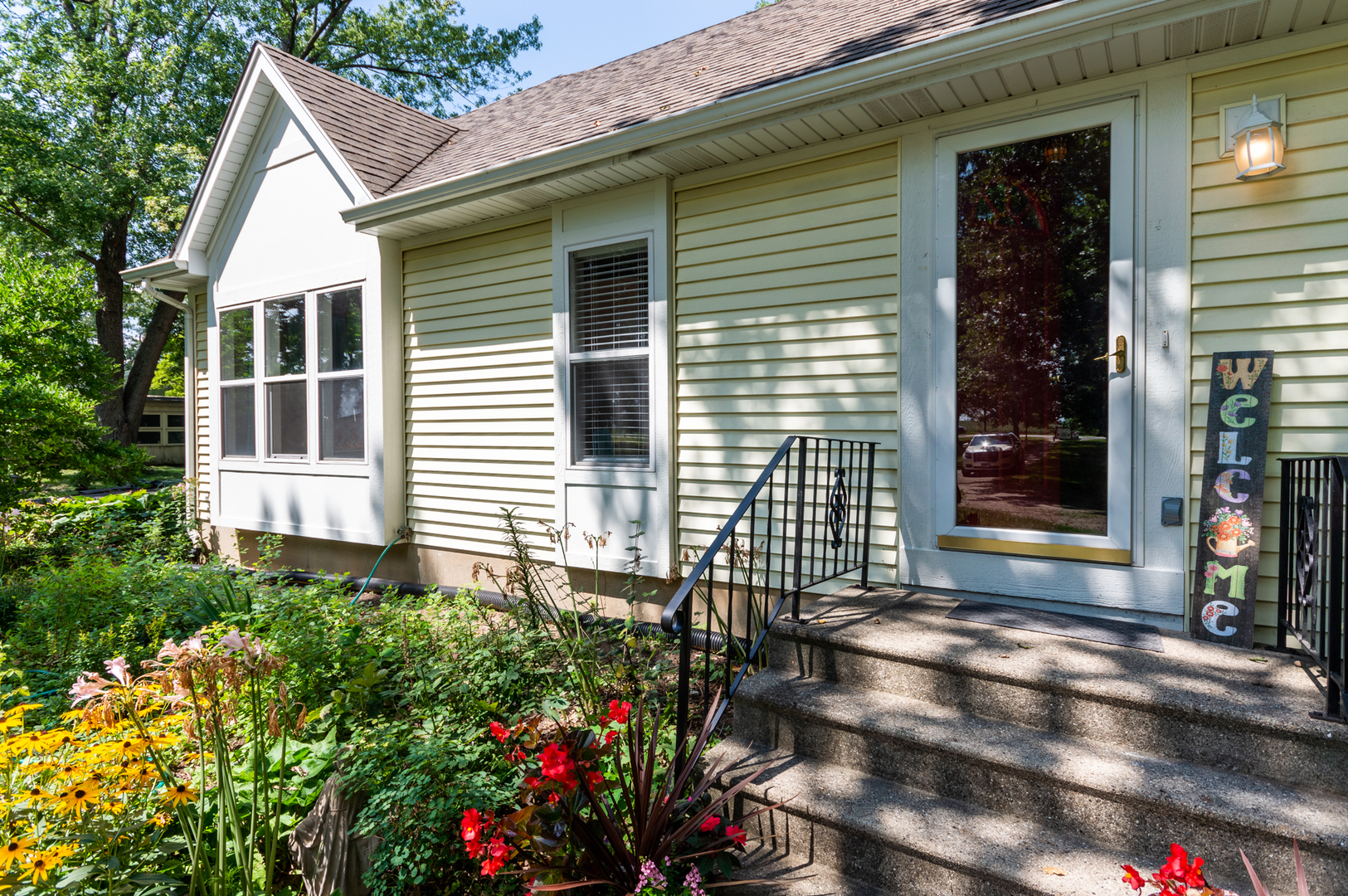 16463 Plank Road Sycamore, IL 60178 - Photo 11 of 36 a view of a house with potted plants