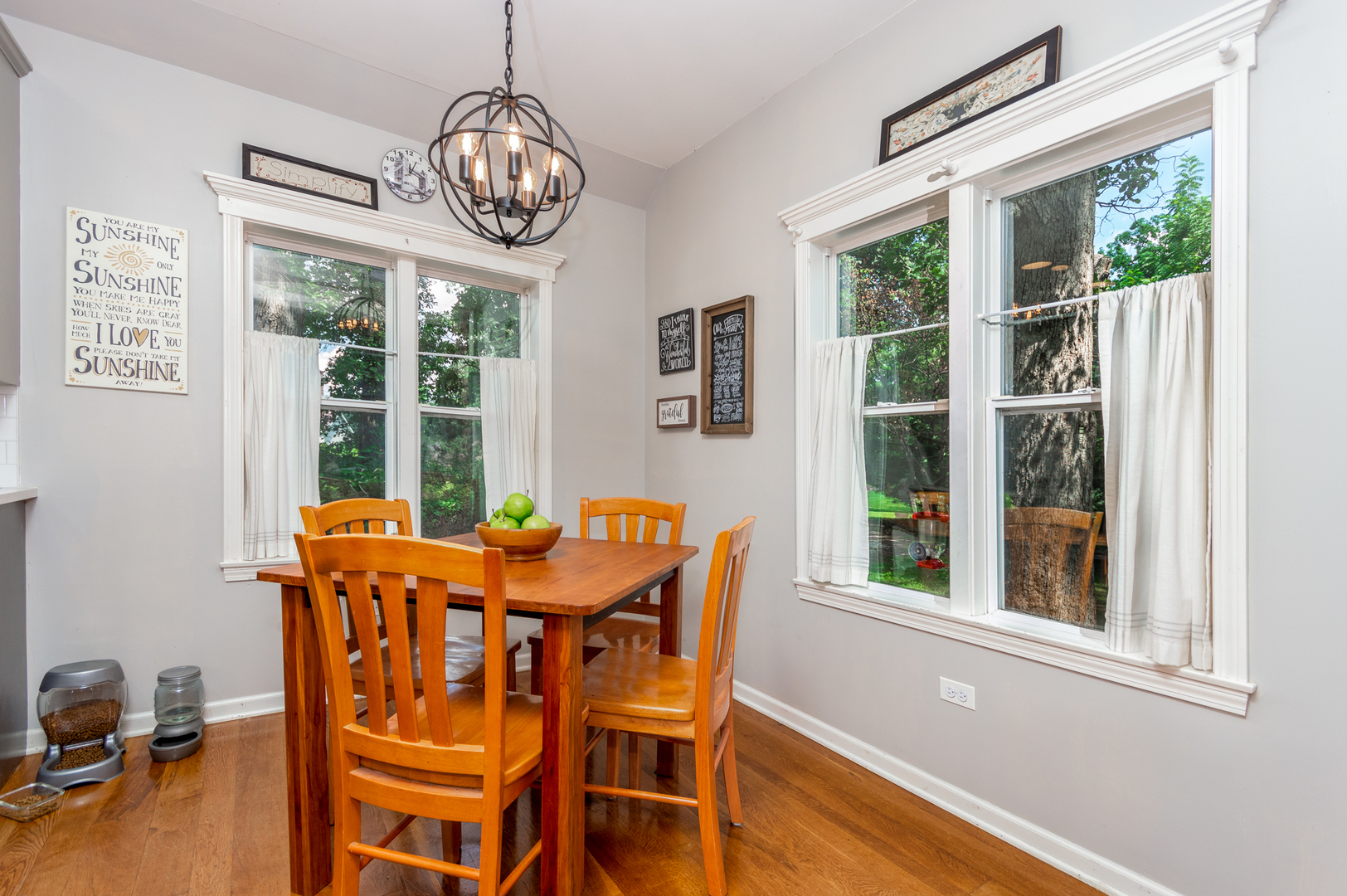 16463 Plank Road Sycamore, IL 60178 - Photo 15 of 36 a dining room with furniture a chandelier and wooden floor