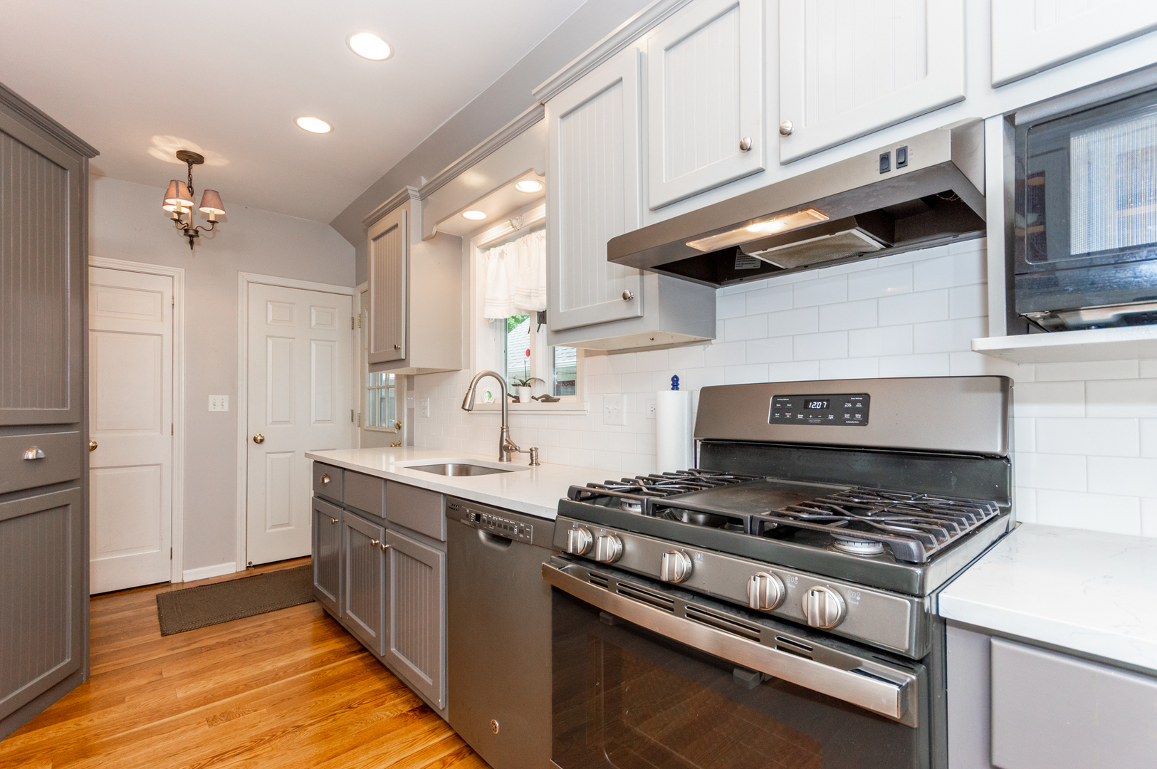 16463 Plank Road Sycamore, IL 60178 - Photo 17 of 36 a kitchen with stainless steel appliances a sink a stove and cabinets