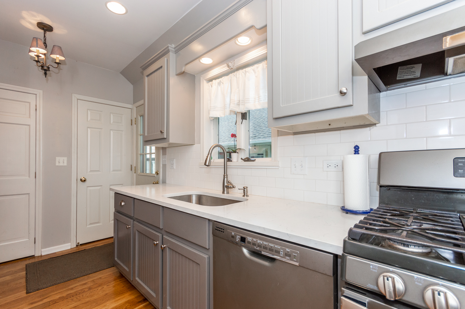 16463 Plank Road Sycamore, IL 60178 - Photo 18 of 36 a kitchen with a sink stove and cabinets