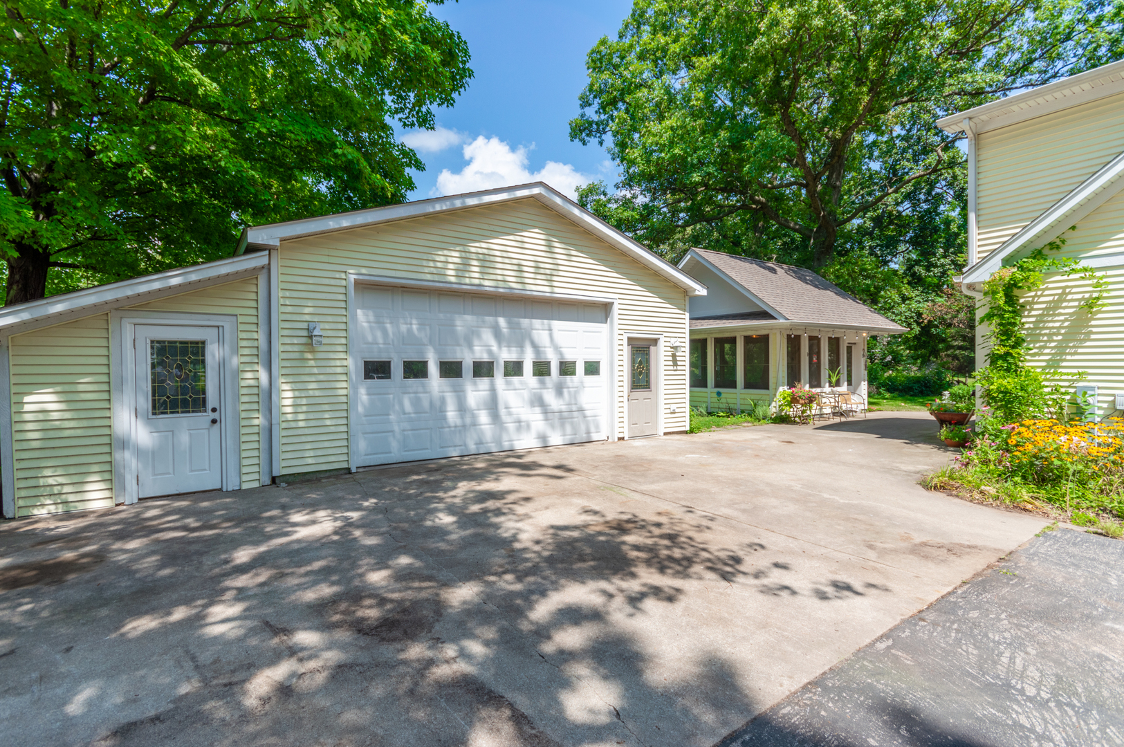 16463 Plank Road Sycamore, IL 60178 - Photo 3 of 36 a view of a house with a yard and potted plants