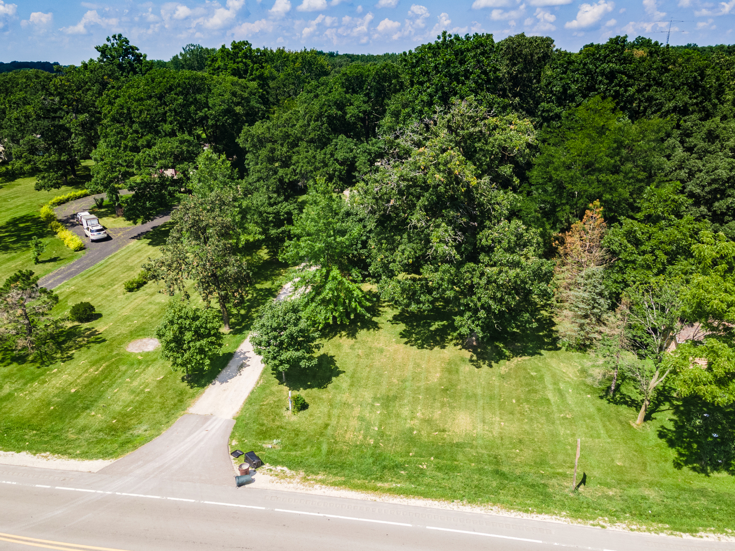 16463 Plank Road Sycamore, IL 60178 - Photo 8 of 36 a view of a yard with a tree