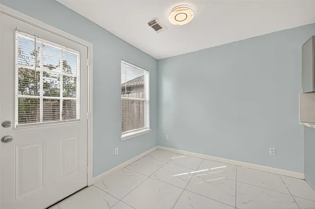 an empty room with windows