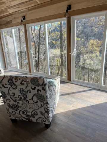 a bathroom with a bathtub and a window