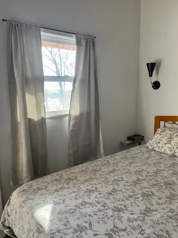 a view of a room with a bedroom