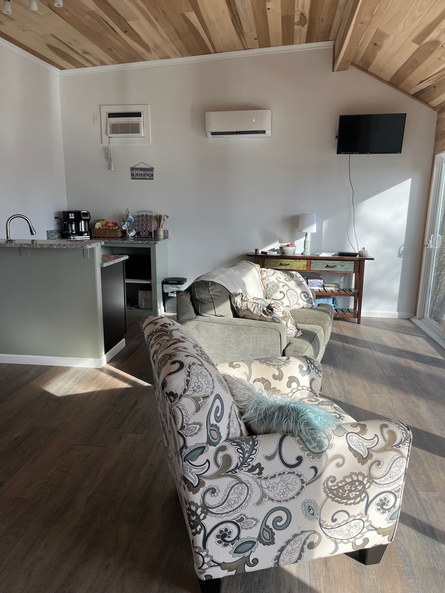 1490 Ford Road Baxter, TN 38544 - Photo 9 of 24 a bed sitting in a room next to a window with kitchen view