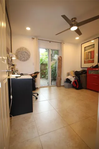 a room with gym equipment and a large window