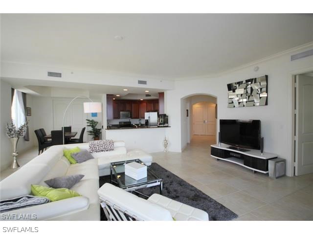 2104 West First Street, Unit 3204 Fort Myers, FL 33901 - Photo 16 of 21 a living room with furniture and a flat screen tv