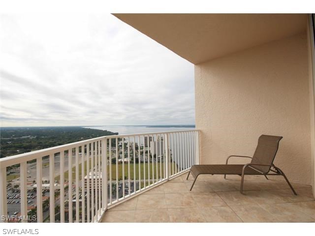 2104 West First Street, Unit 3204 Fort Myers, FL 33901 - Photo 19 of 21 a view of a chair and table on the terrace