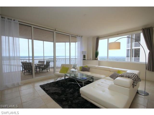 2104 West First Street, Unit 3204 Fort Myers, FL 33901 - Photo 2 of 21 a living room with furniture and a large window