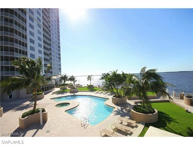 2104 West First Street, Unit 3204 Fort Myers, FL 33901 - Photo 10 of 21 a swimming pool with outdoor seating and yard