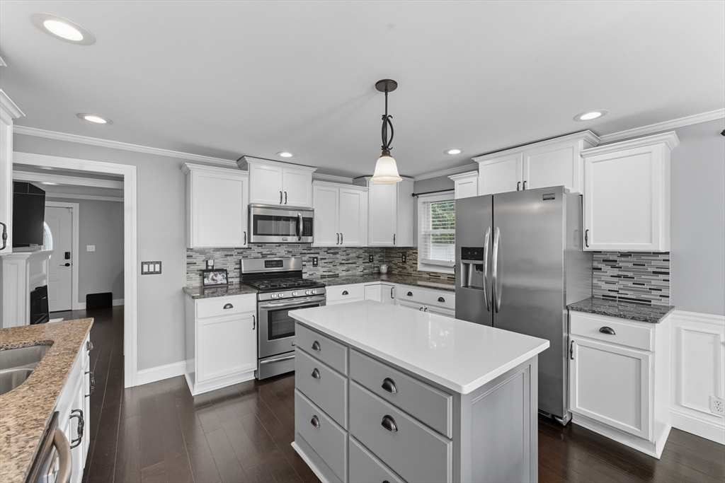 53 Druids Lane West Springfield, MA 01089 - Photo 16 of 42 a kitchen with white cabinets and stainless steel appliances