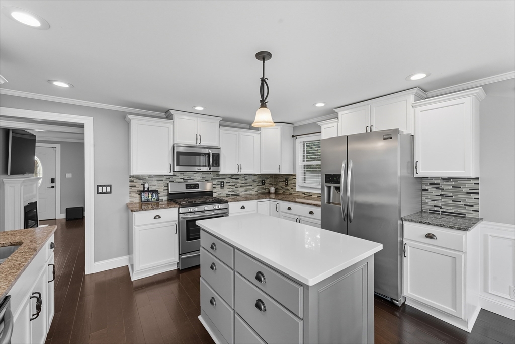 53 Druids Lane West Springfield, MA 01089 - Photo 19 of 42 a kitchen with white cabinets and stainless steel appliances