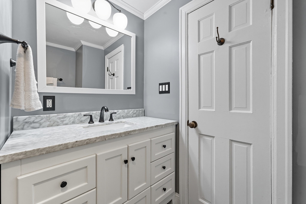 53 Druids Lane West Springfield, MA 01089 - Photo 26 of 42 a bathroom with a granite countertop sink and a mirror
