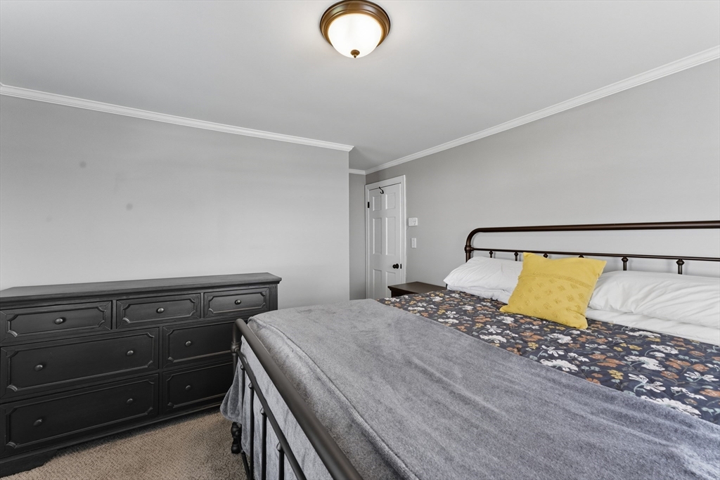 53 Druids Lane West Springfield, MA 01089 - Photo 28 of 42 a bedroom with a bed and a lamp with the dresser