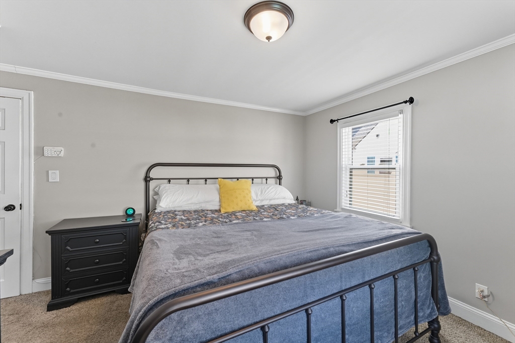 53 Druids Lane West Springfield, MA 01089 - Photo 30 of 42 a bedroom with a bed and mirror