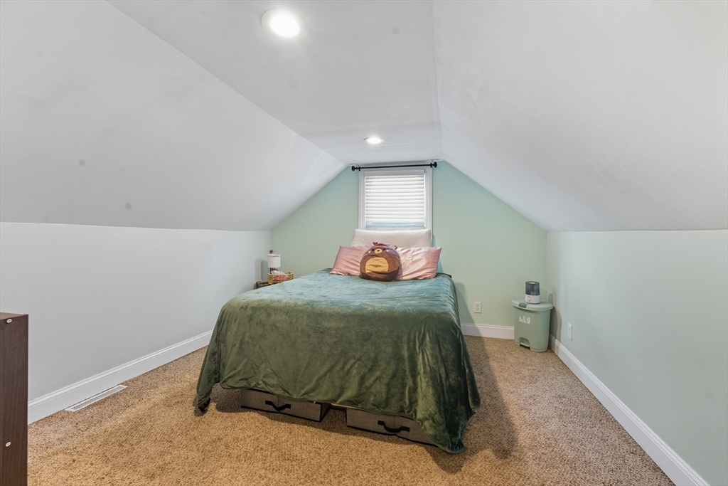 53 Druids Lane West Springfield, MA 01089 - Photo 33 of 42 a bedroom with a bed and a lamp