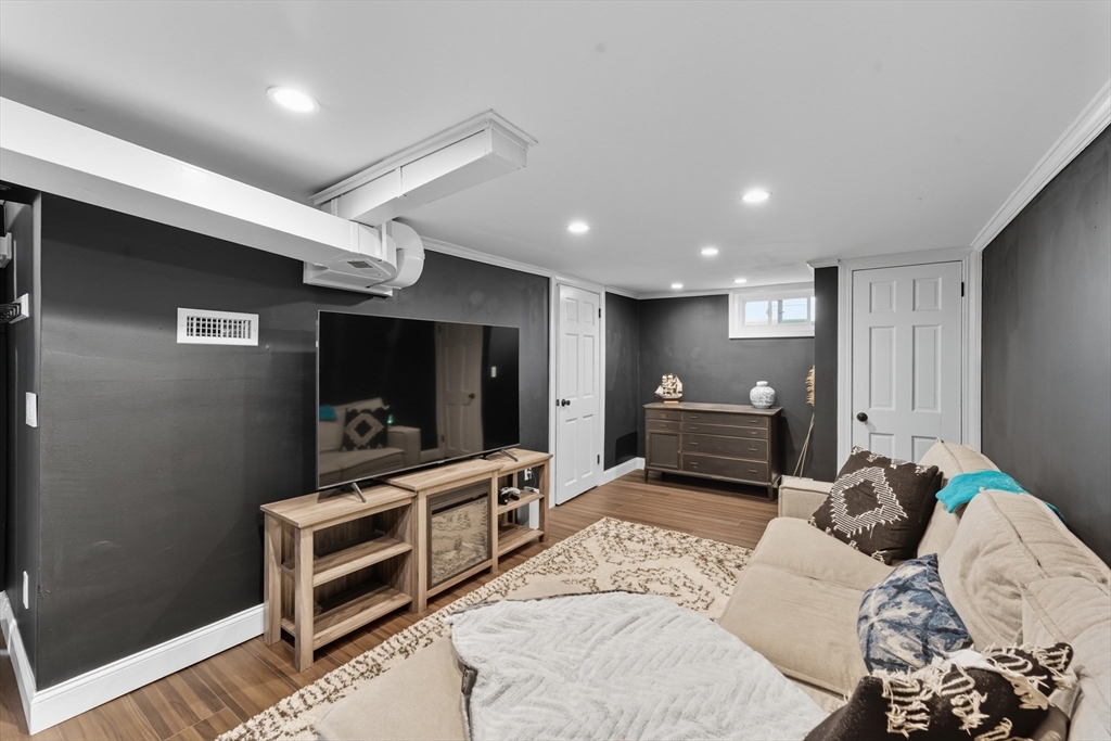 53 Druids Lane West Springfield, MA 01089 - Photo 36 of 42 a living room with furniture and a flat screen tv