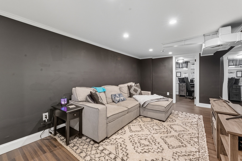 53 Druids Lane West Springfield, MA 01089 - Photo 37 of 42 a living room with furniture and a wooden floor