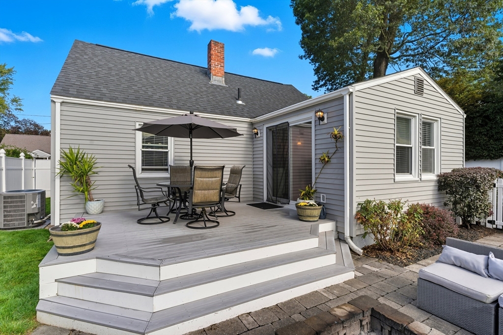 53 Druids Lane West Springfield, MA 01089 - Photo 5 of 42 a view of a patio with table and chairs and potted plants